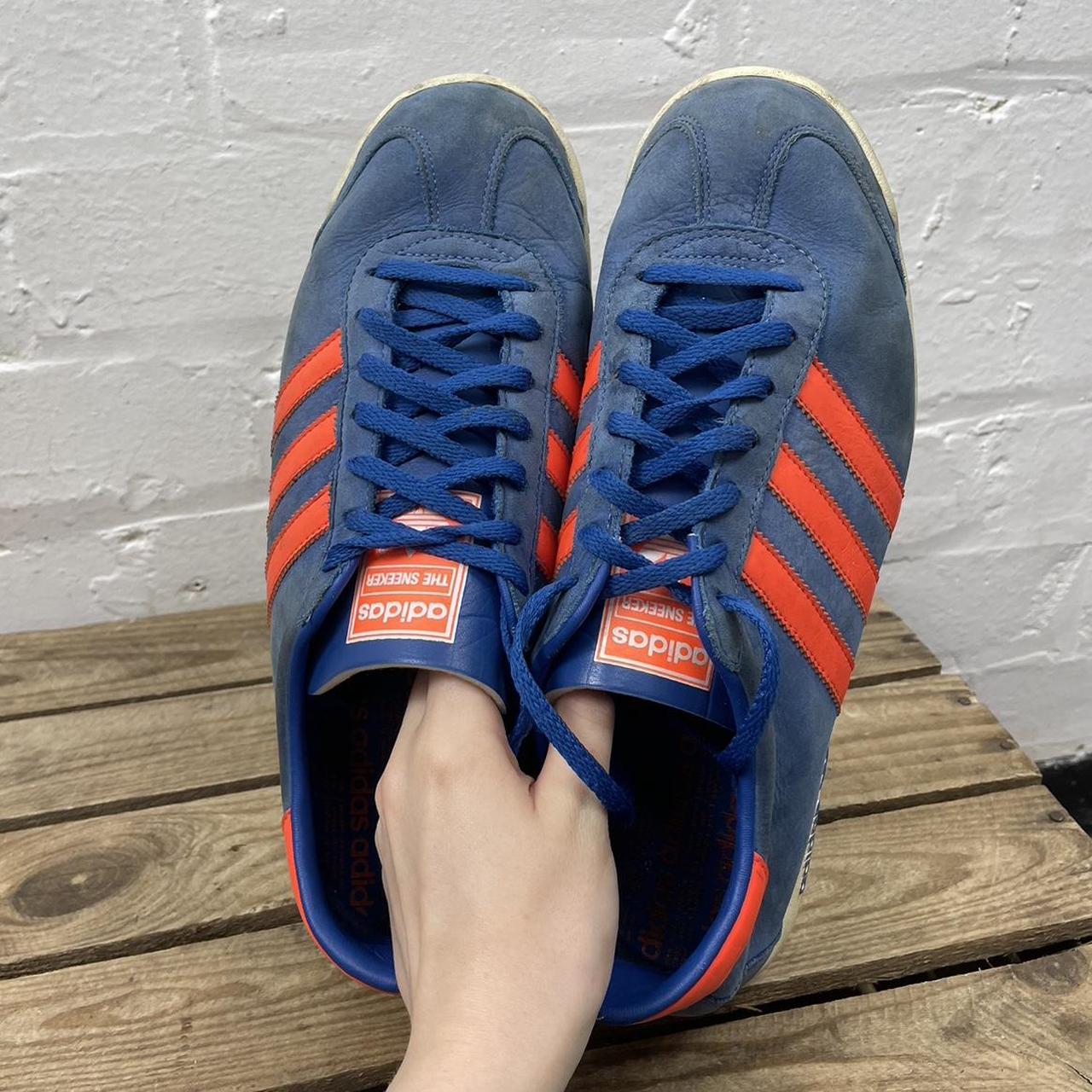 Features Adidas trainers blue and orange unsure of