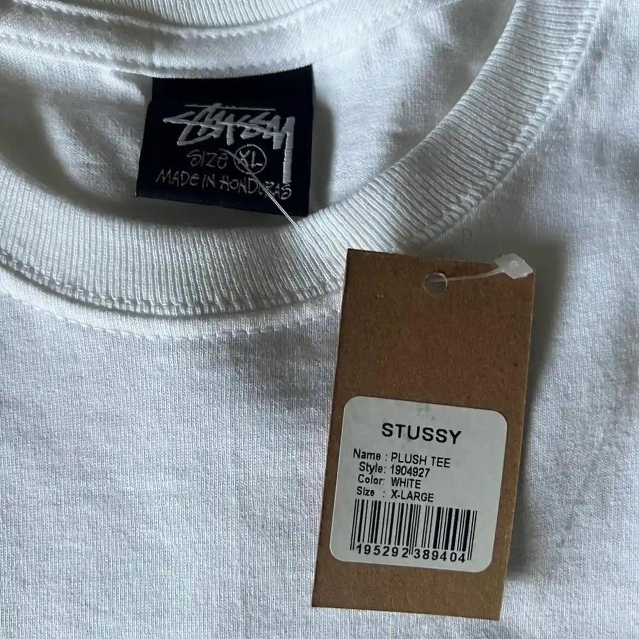 Stussy - plush white tee (graphic on back of tee)...