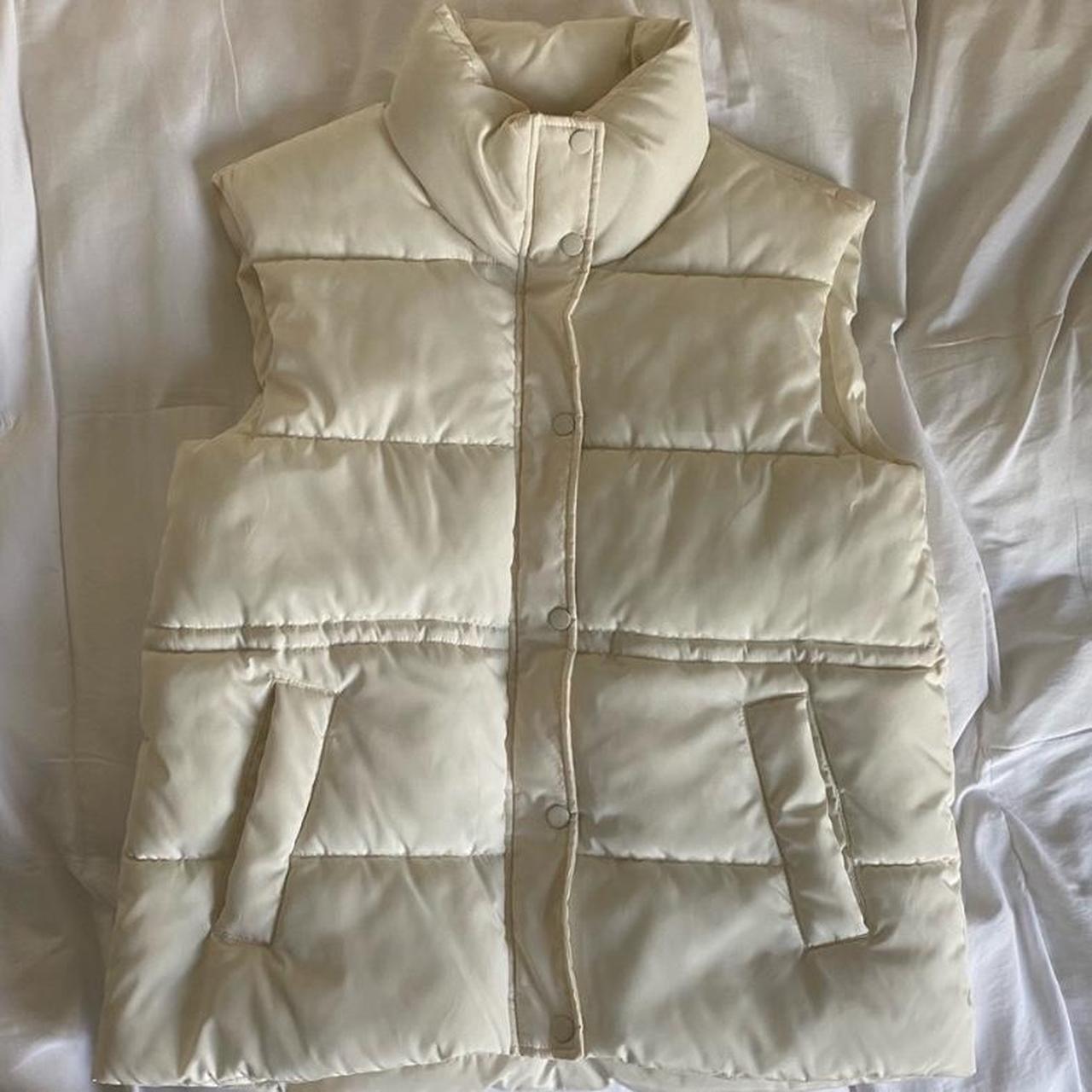 white puffer vest barely worn; labeled size medium /... - Depop