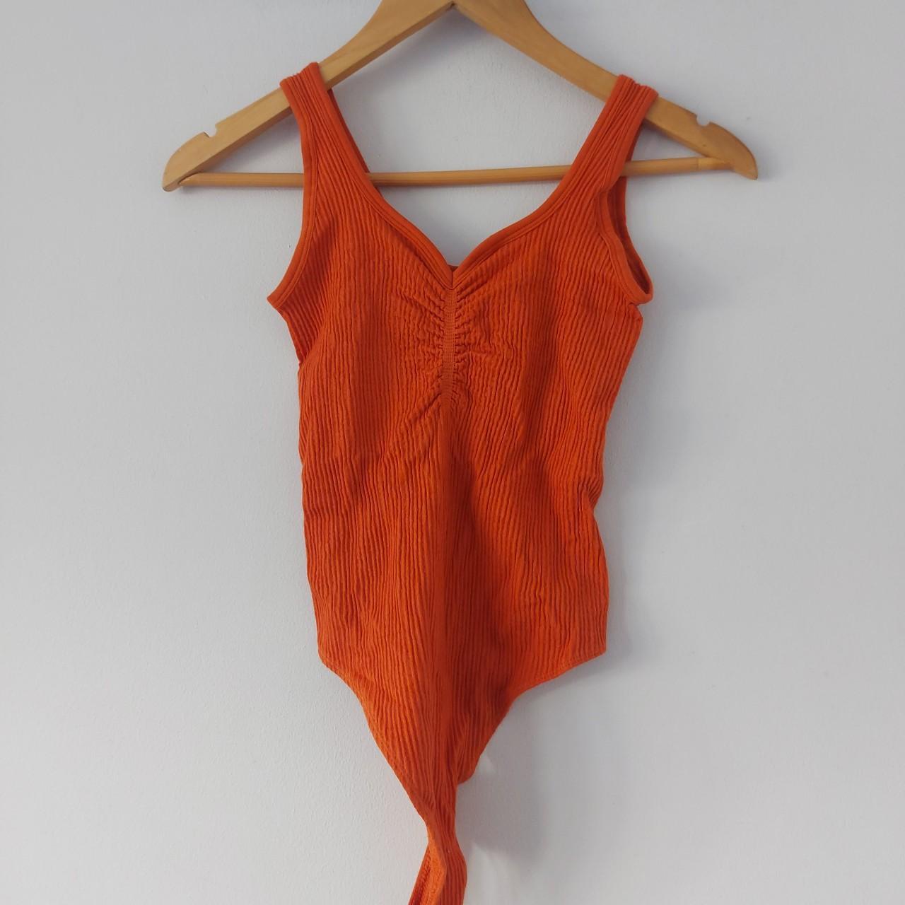 Urban Outfitters orange ruched bodysuit. Stretchy... Depop