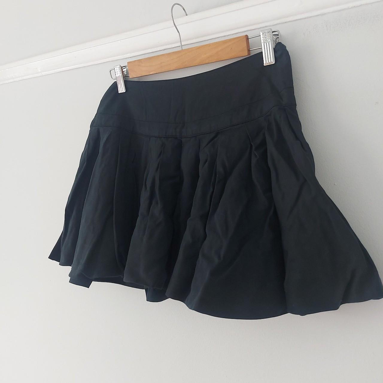 Free People Black bubble hem mini skirt. Side zip... - Depop