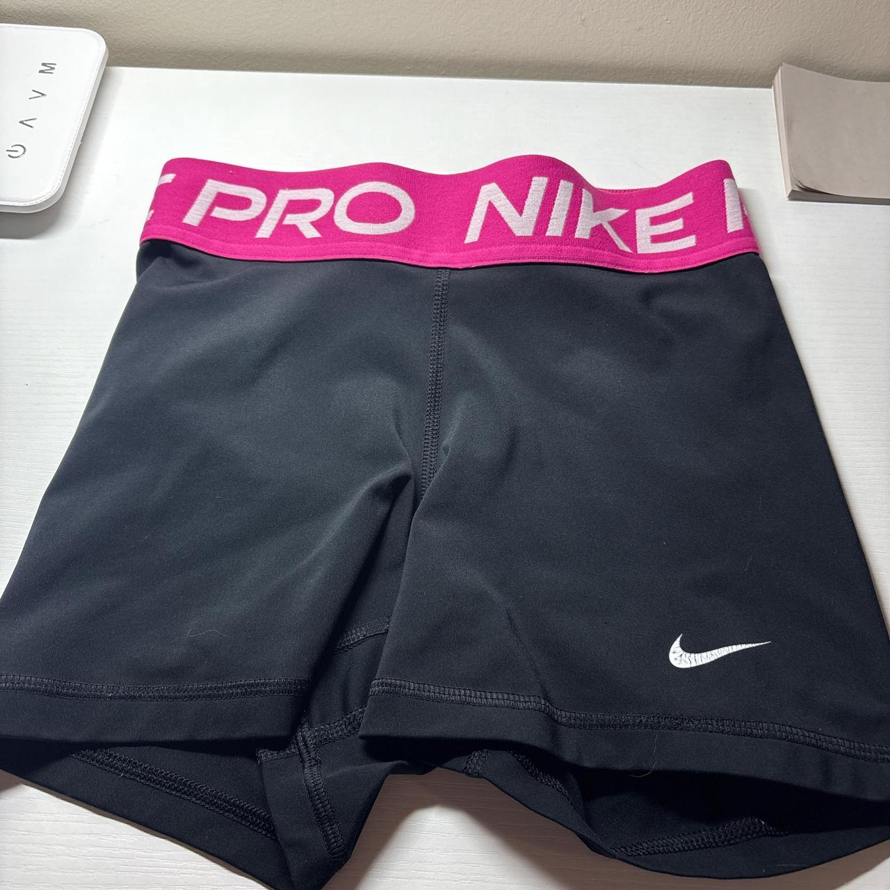 black nike pro shorts with pink band
