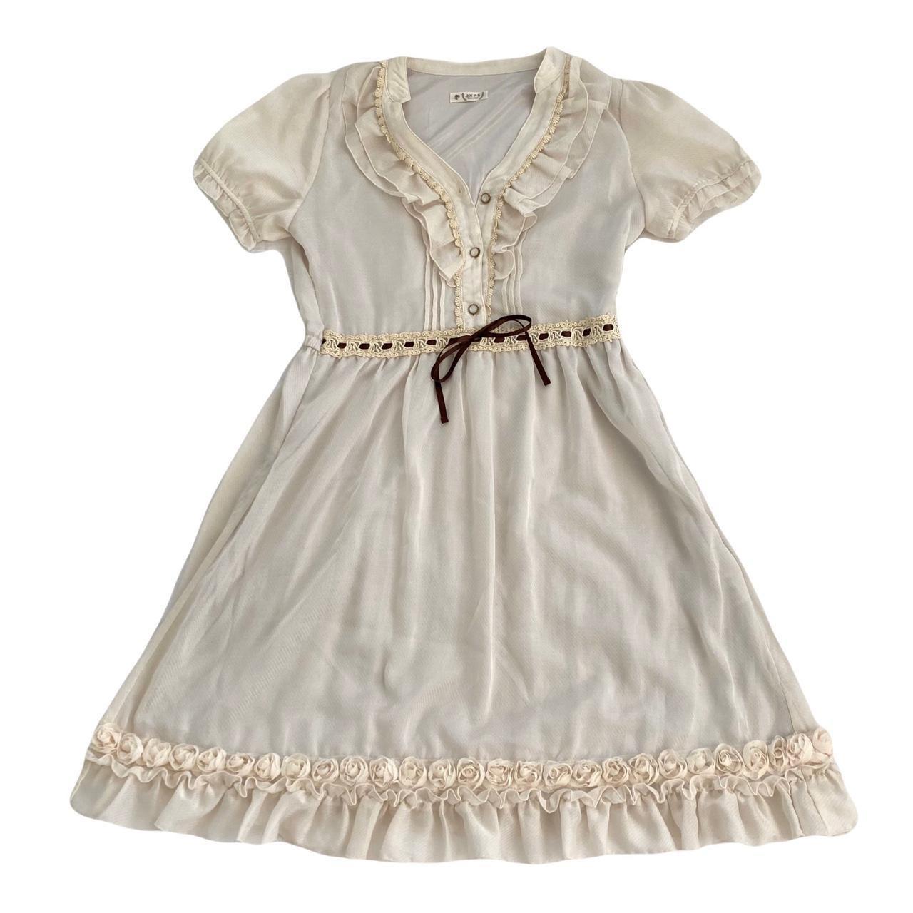 Dainty cream vanilla axes femme dress featuring... Depop