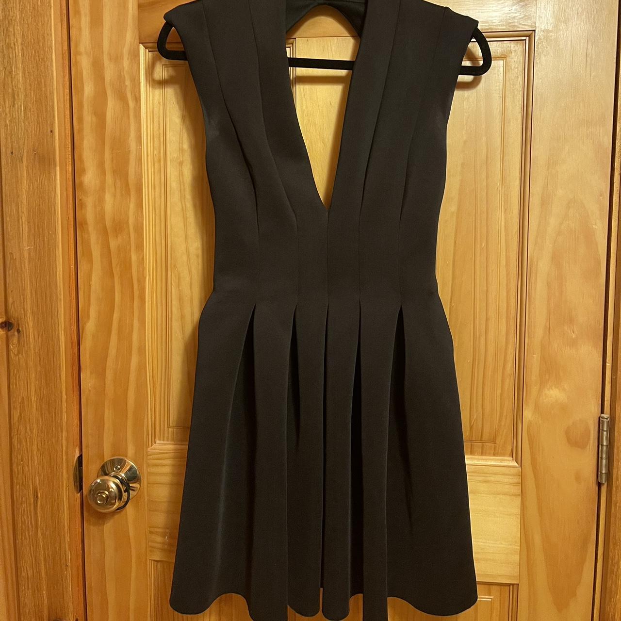 Neoprene open back mini dress. Deep v neck in the