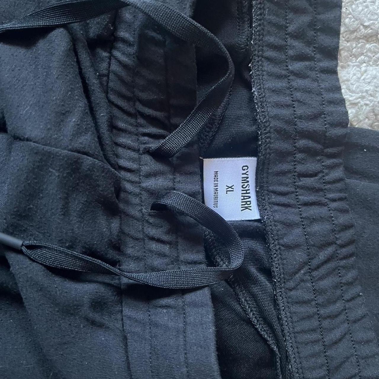 black gymshark sweatpants size xl but fits like... Depop