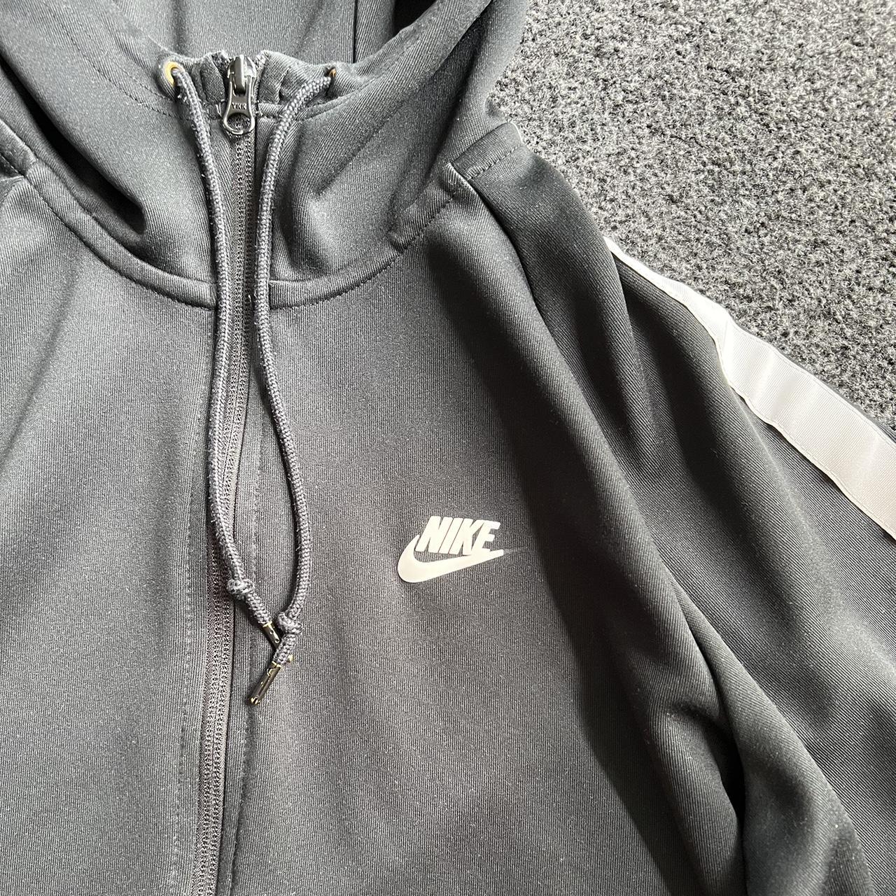 Men’s Nike black jacket End of tick is missing as... - Depop