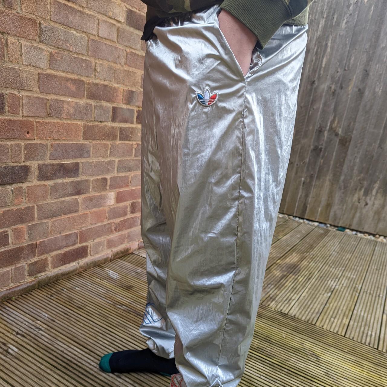 Selling these futuristic Adidas silver shiny track... - Depop
