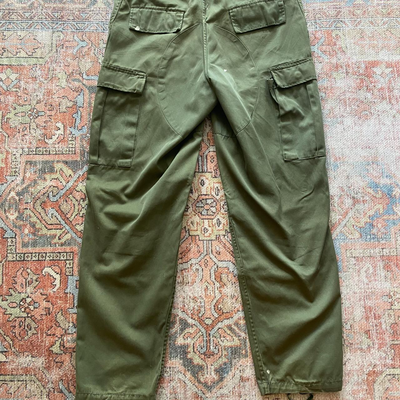 Vintage, distressed army pants with elastic belt....