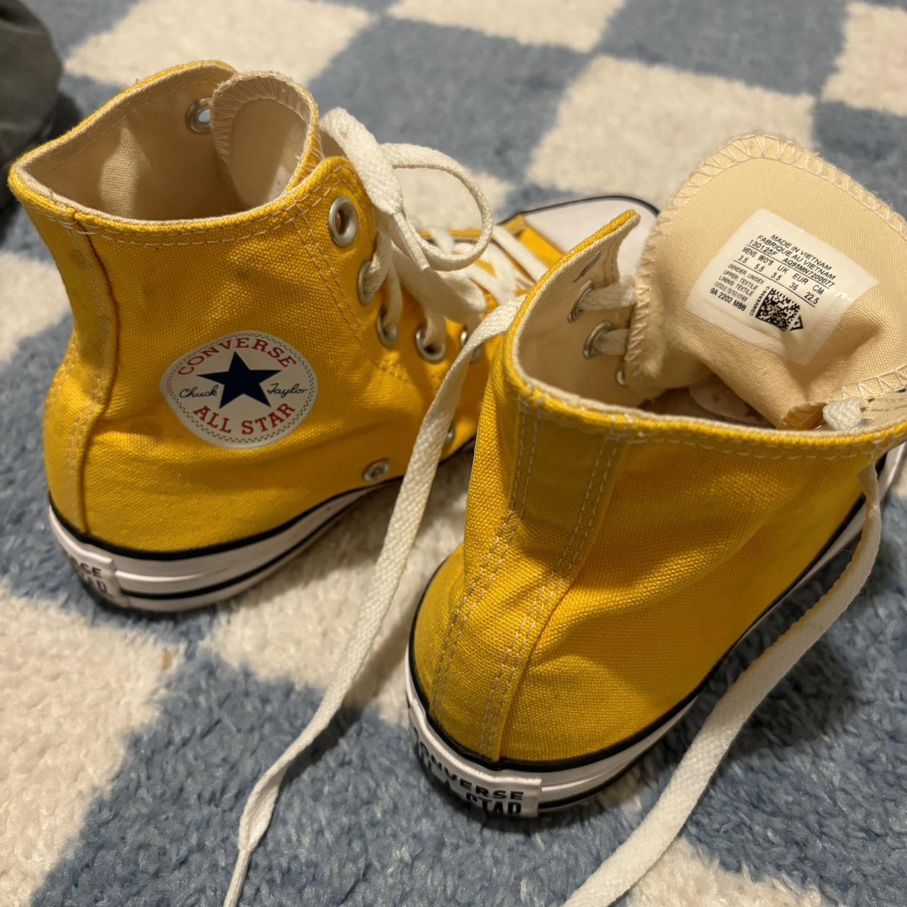 Marigold yellow Chuck Taylor Converse high tops