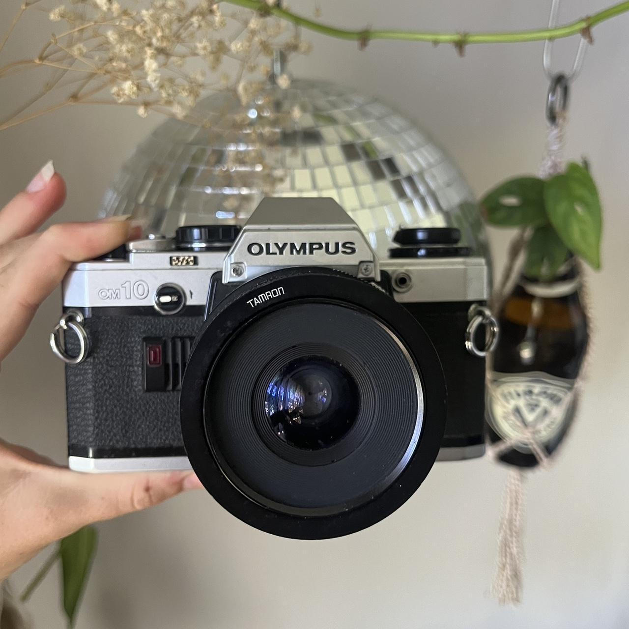 Olympus om10 film camera Just needs a new battery... - Depop