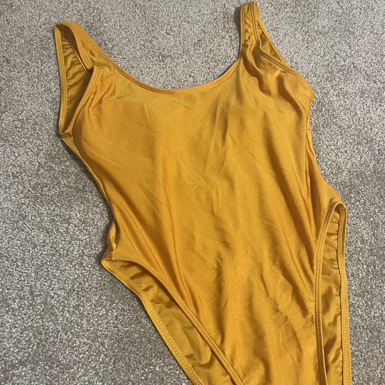 Orange swimsuit with low back size medium - Depop