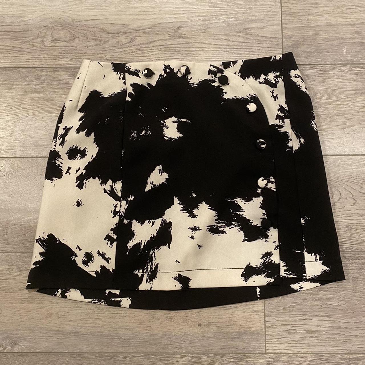 Urban outfitters black and white paint cow print