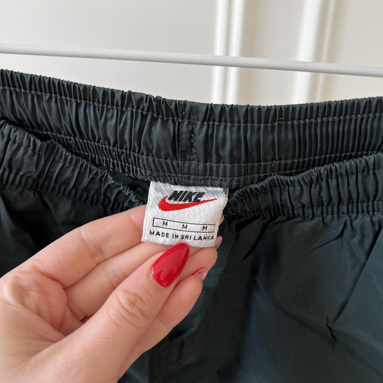 Vintage nike track pants in dark green size medium... Depop
