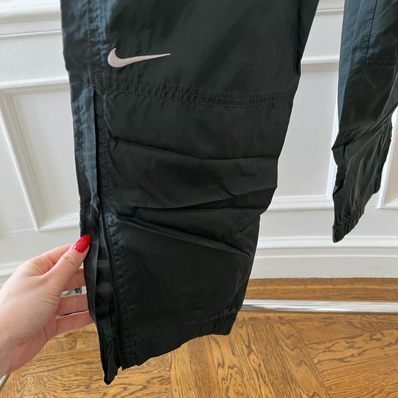 Vintage nike track pants in dark green size medium... Depop