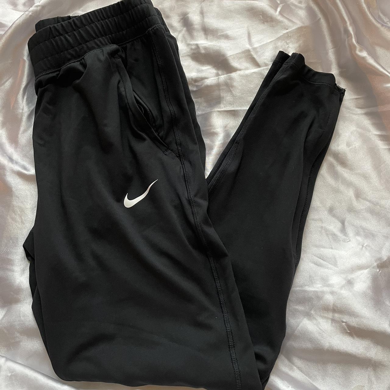 Nike dry fit tapered joggers with jaguar paw print - Depop