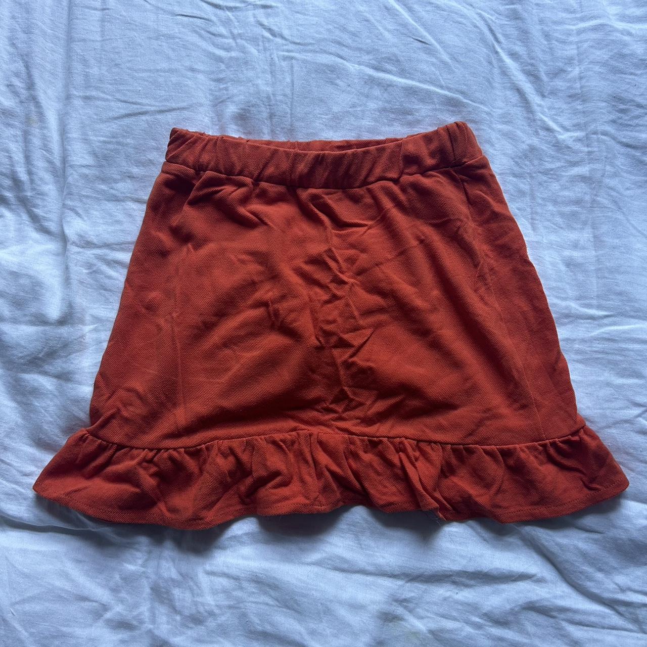 Bright orange ruffle mini skirt peplum skirt from... Depop