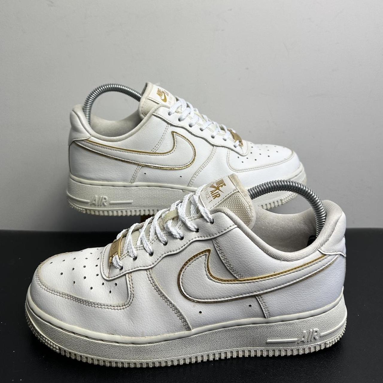 Nike white with gold swoosh hotsell