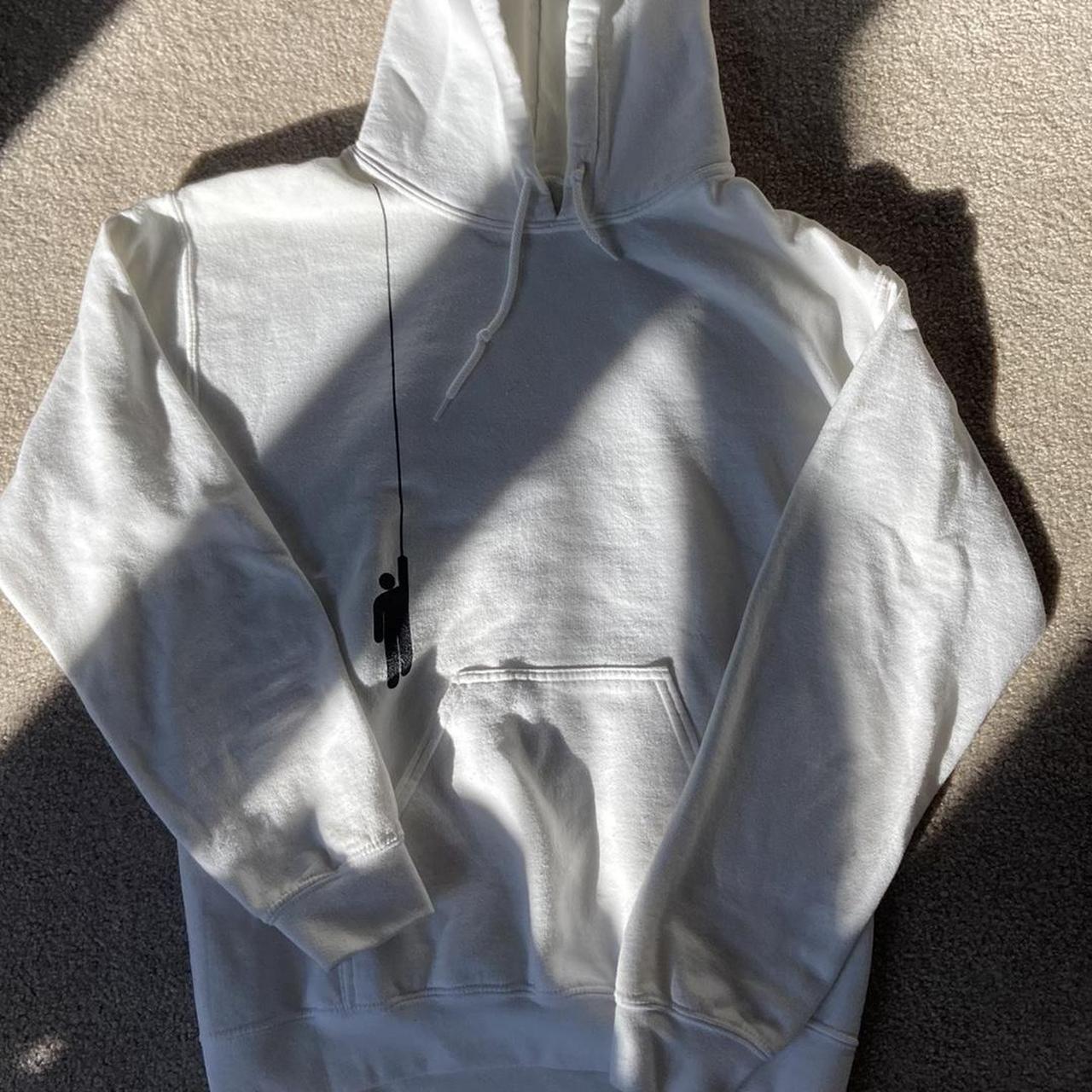 white billie eilish hanging hoodie from one of her