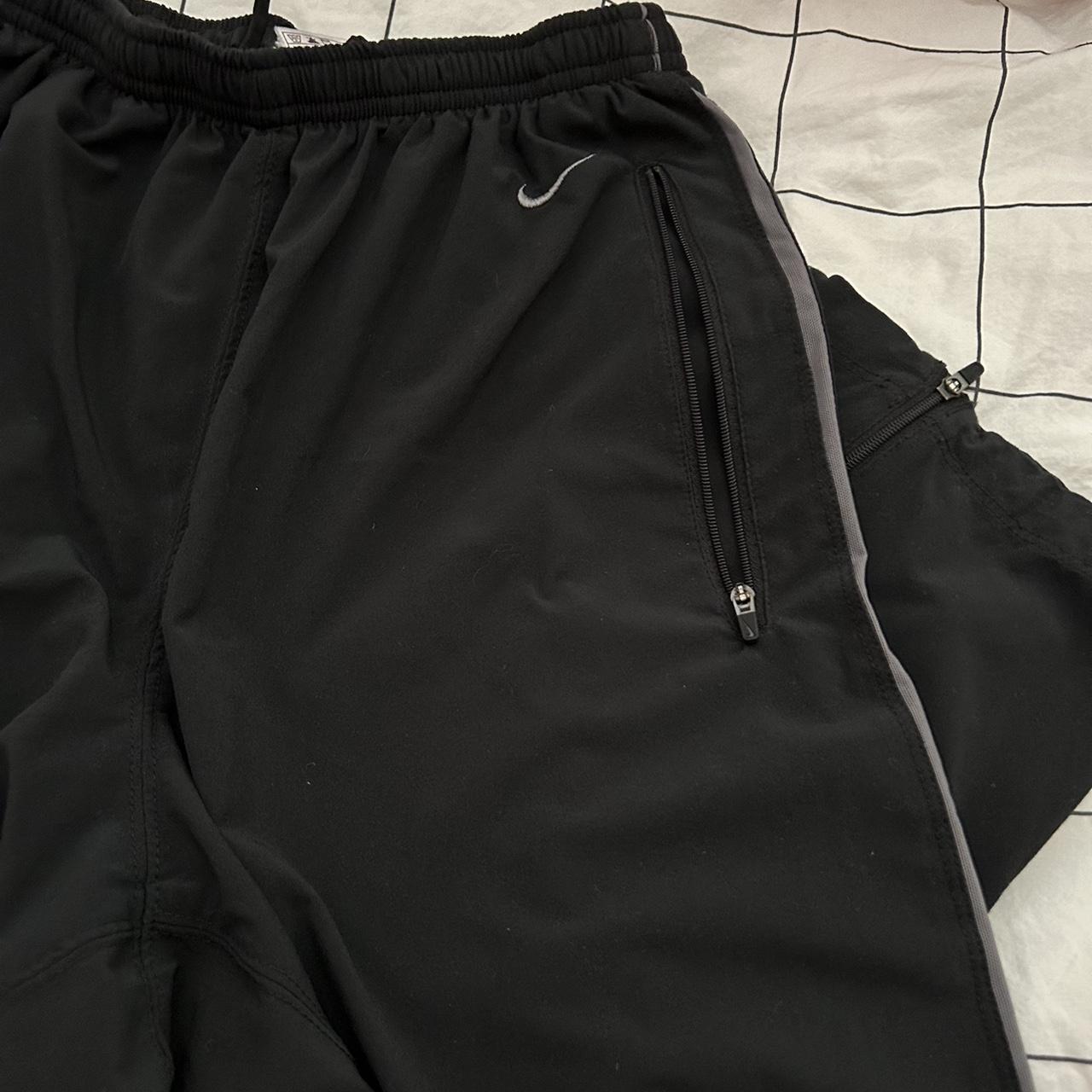 Vintage, dri-fit, baggy, black nike track pants with... - Depop