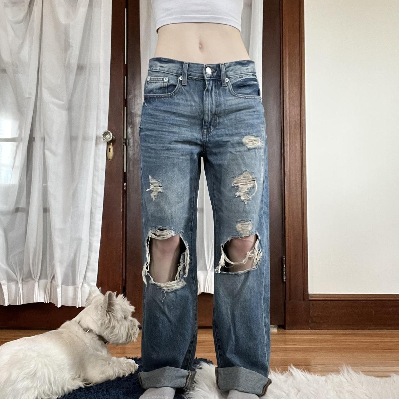 Low waisted, ripped, medium/dark blue jeans from... - Depop