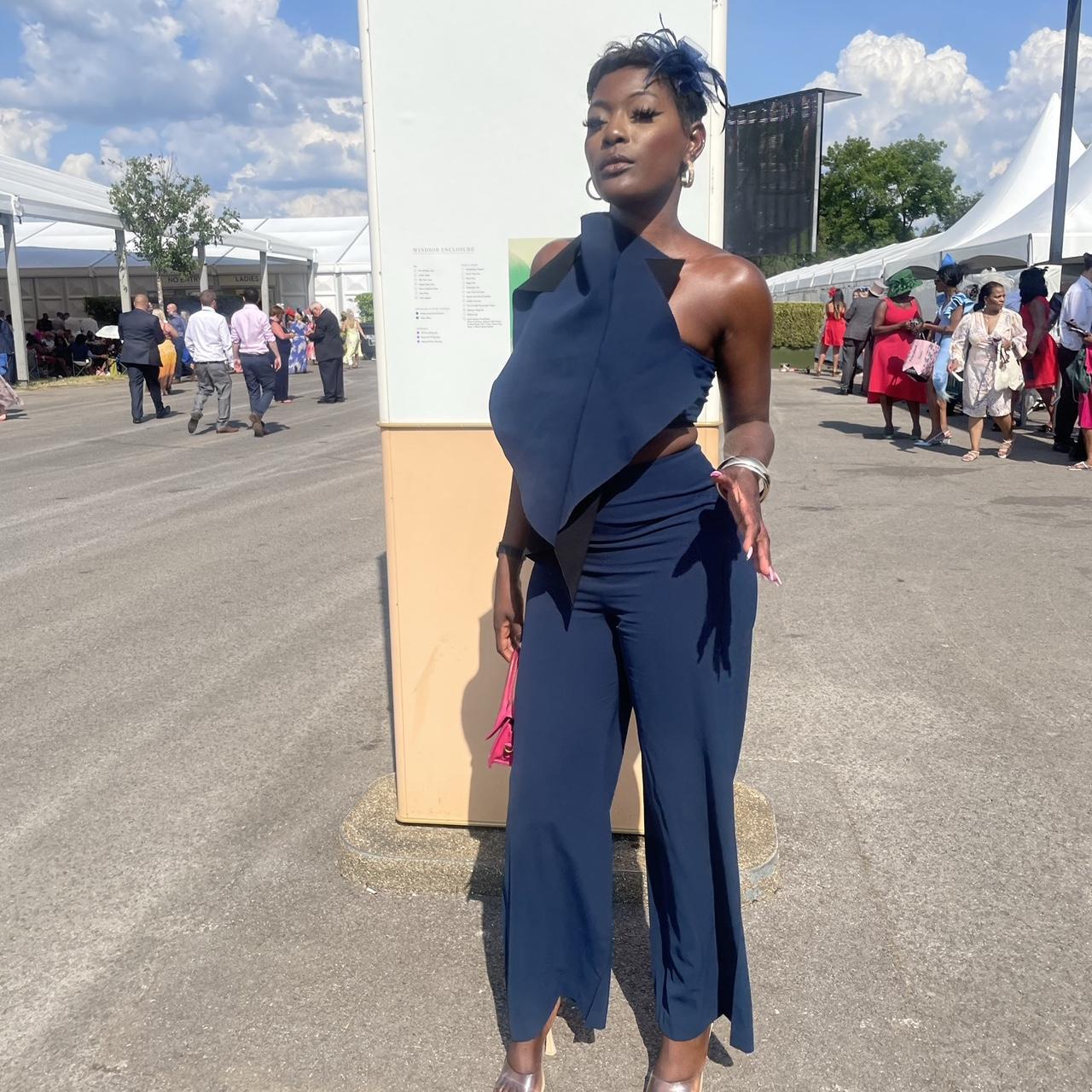 selling this gorgeous navy blue AQAQ jumpsuit. It s