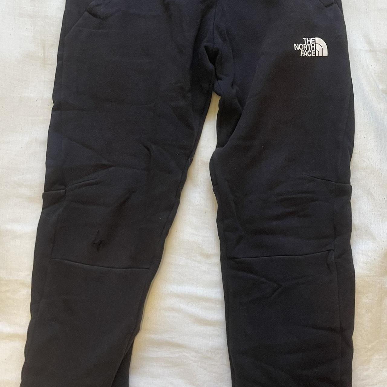 The north face boys large joggers with slight rip of... - Depop