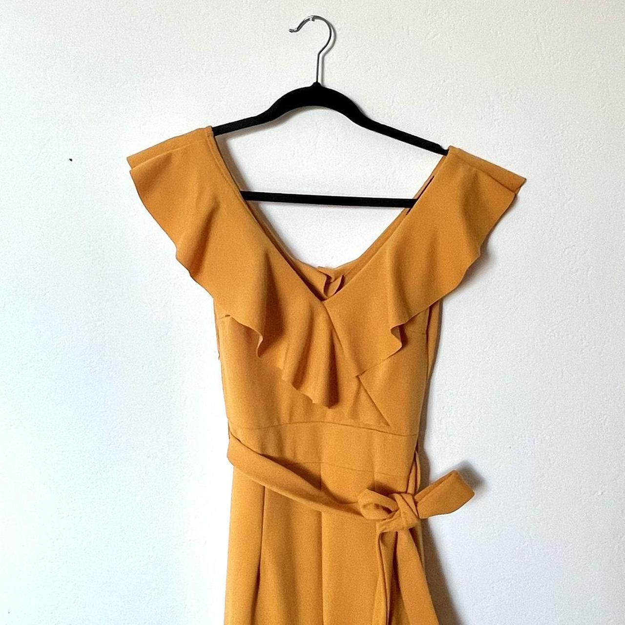 Yellow jumpsuit with ruffles size 8 Wide... - Depop