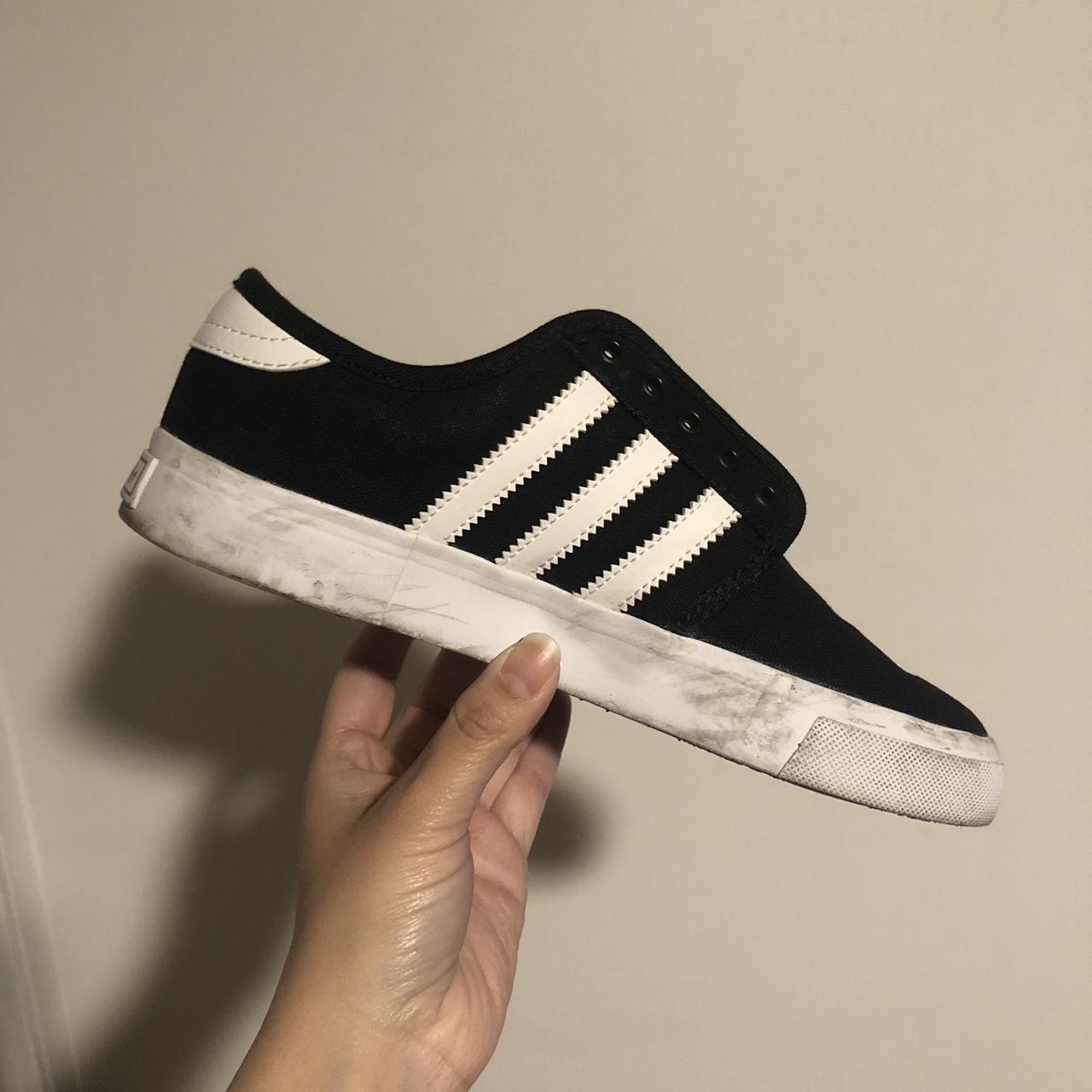 Black and white Adidas trainers No laces and a bit