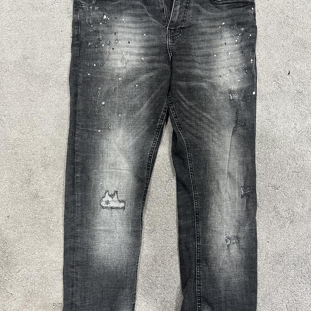 Black and white jeans with paint splatters