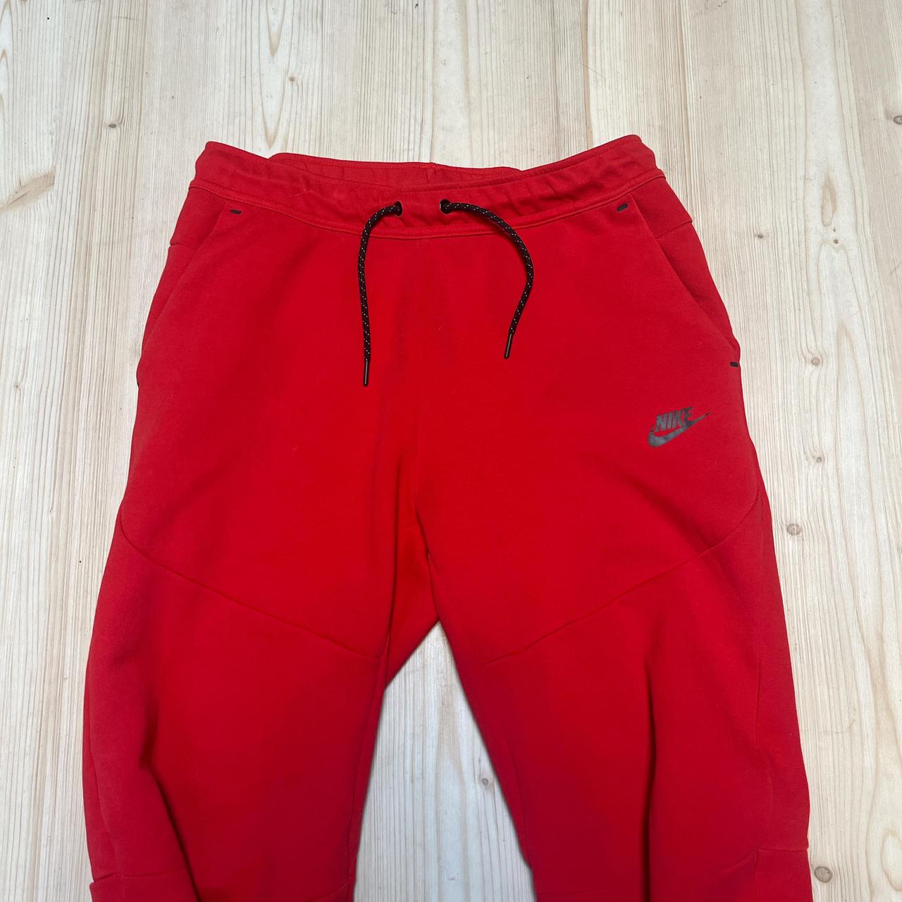 red nike tech pants
