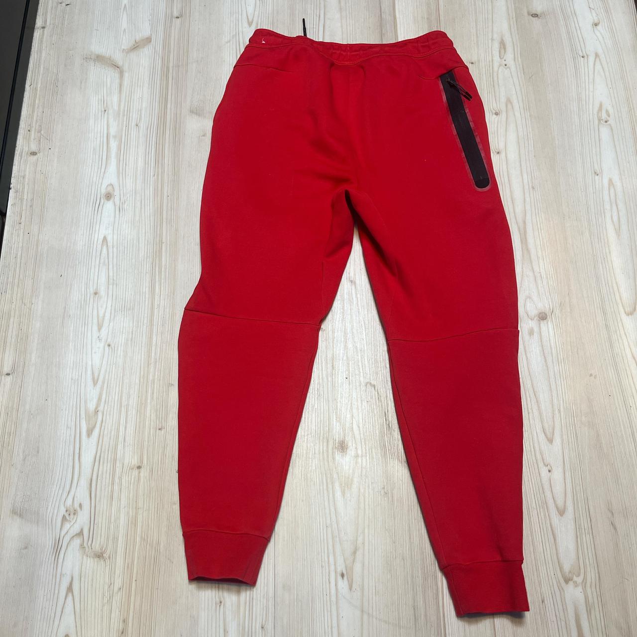 red nike tech pants