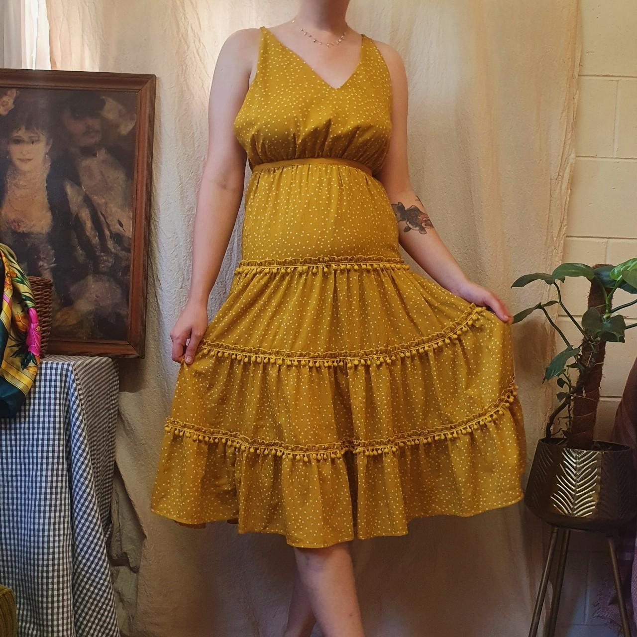 Mustard yellow polka dot tiered dress with cross... Depop