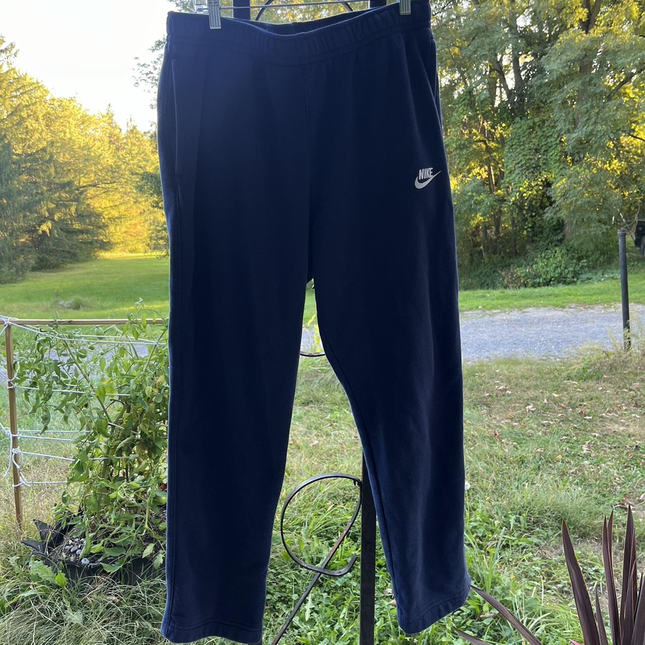 Navy Blue Nike sweatpants with wide bottom. Depop