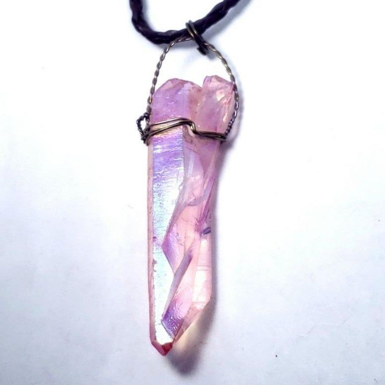 A bright pink aura quartz crystal wire wrapped in... - Depop