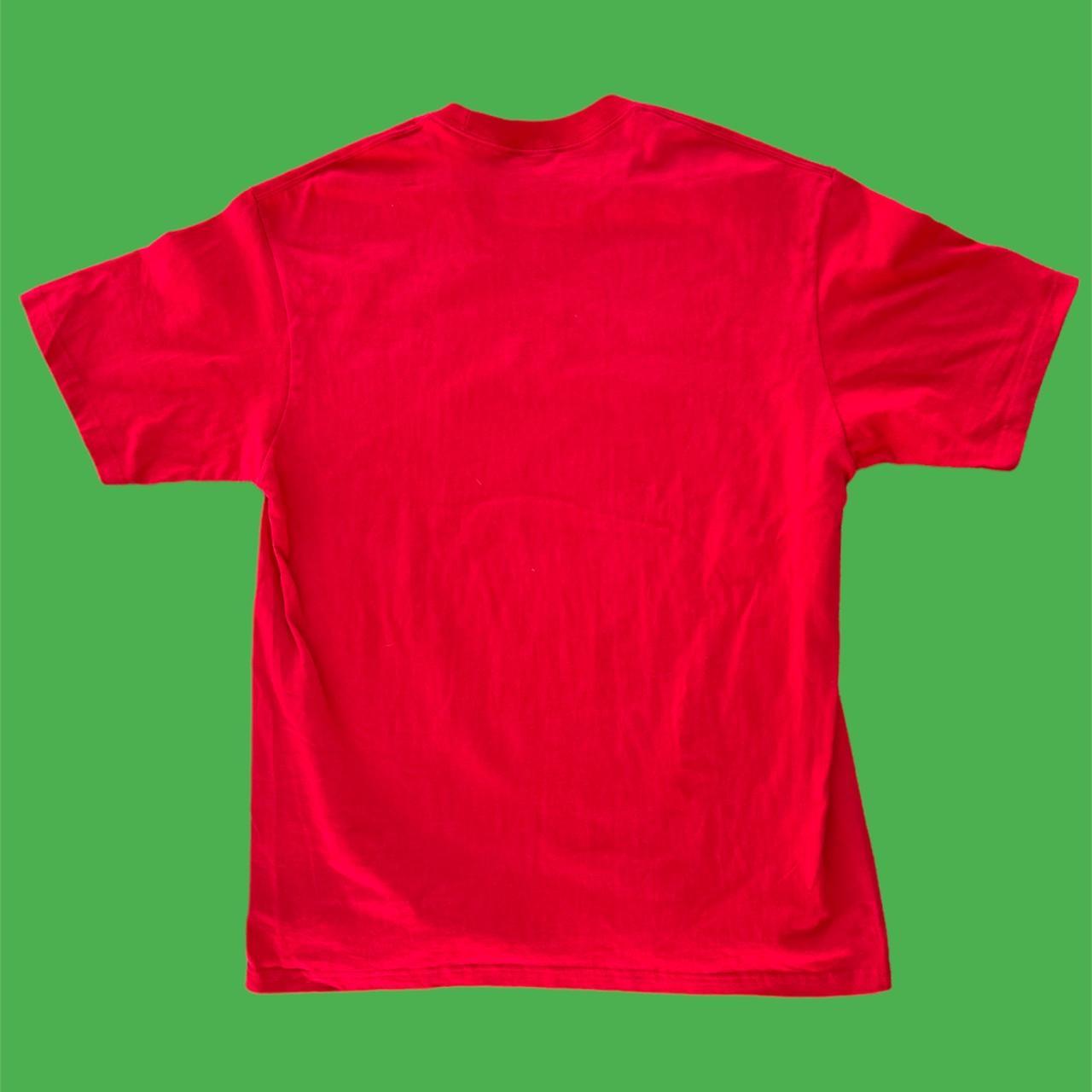 Red Supreme hand style logo spell out graphic tee...
