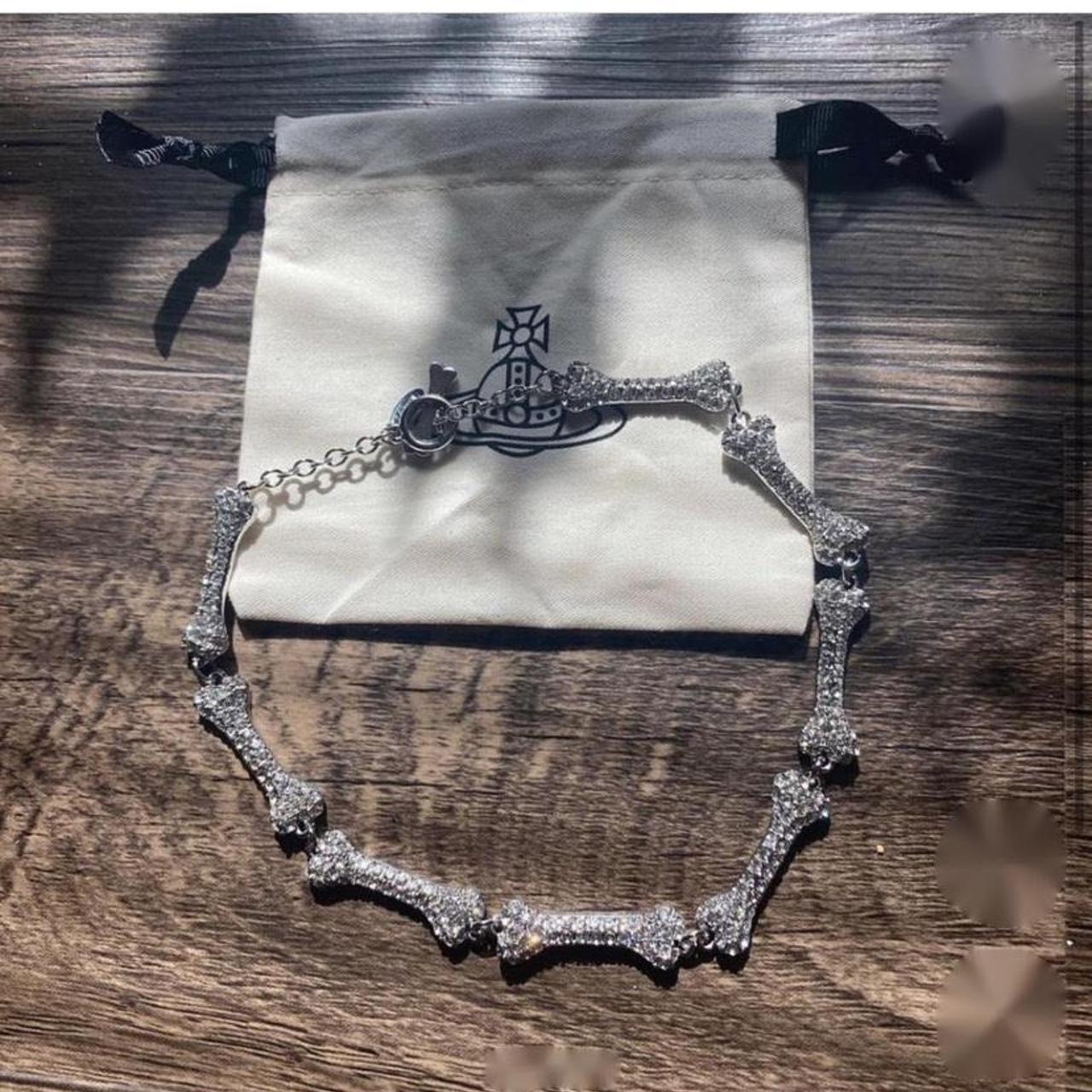 SOLD Vivienne Westwood Fist and Bone necklace * Excellent condition *  Double chain * Clear detail * “Diamond” on the finger * Color:… | Instagram