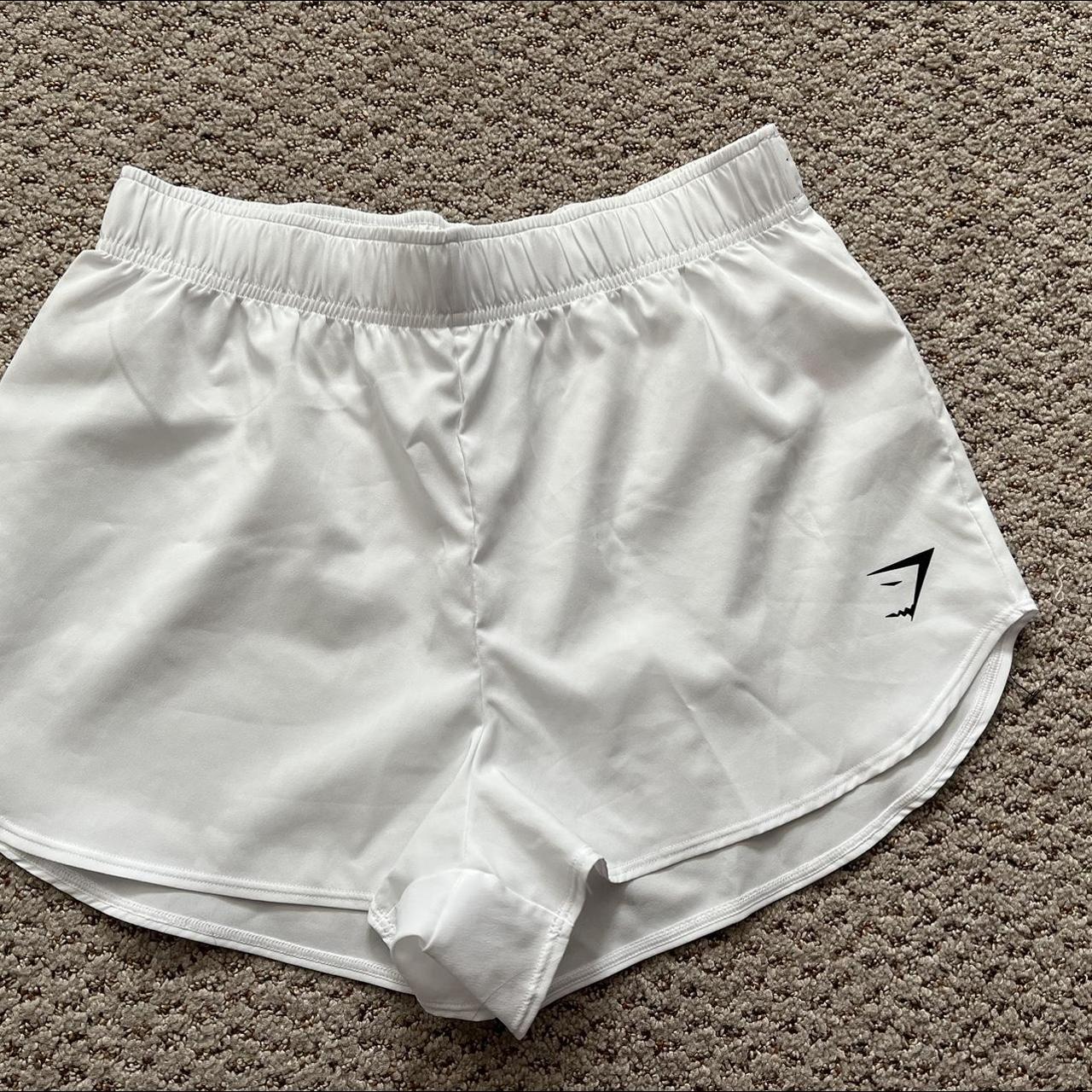 Gymshark white shorts Thin material, a little see... Depop