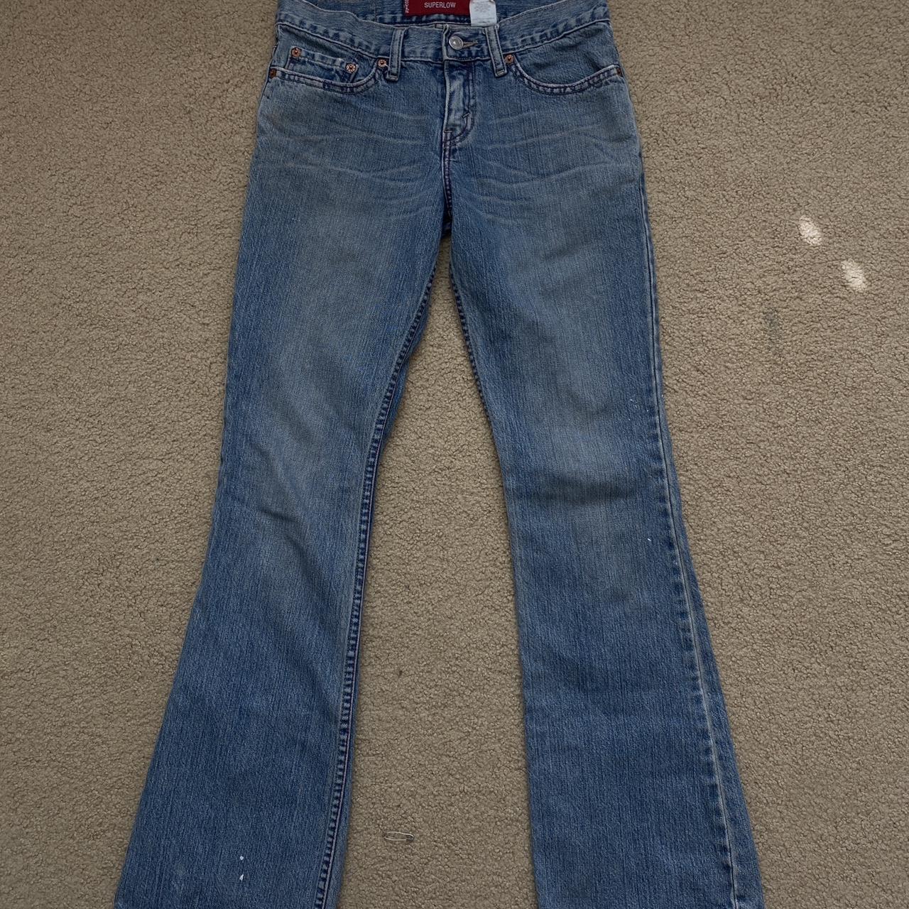 Levi’s super low bootcut jeans measurements laying... - Depop