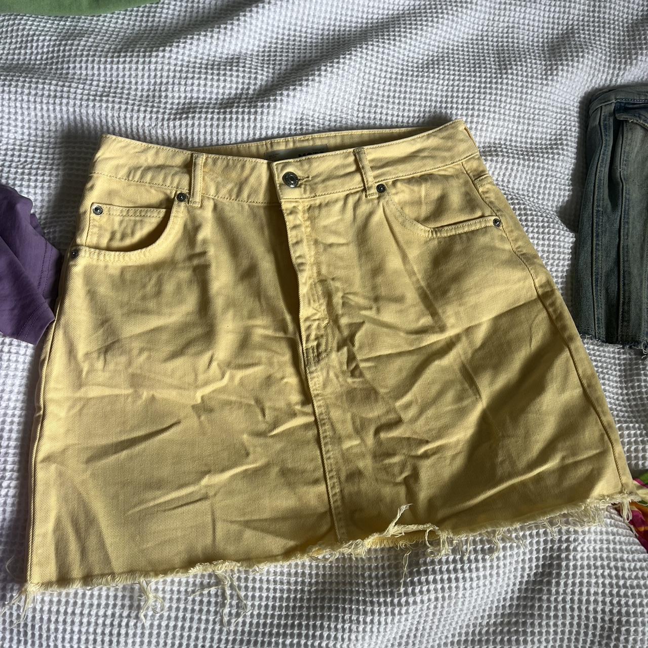 Yellow denim skirt from Topshop with distressed hem.... - Depop