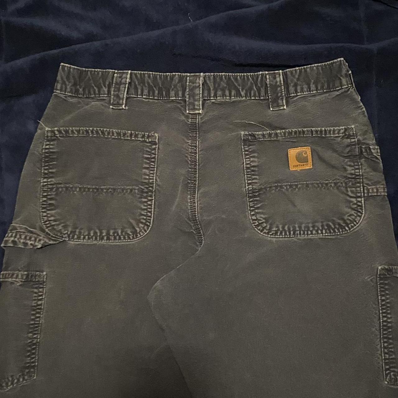 Black Carhartt carpenter pants. Distressed with... - Depop