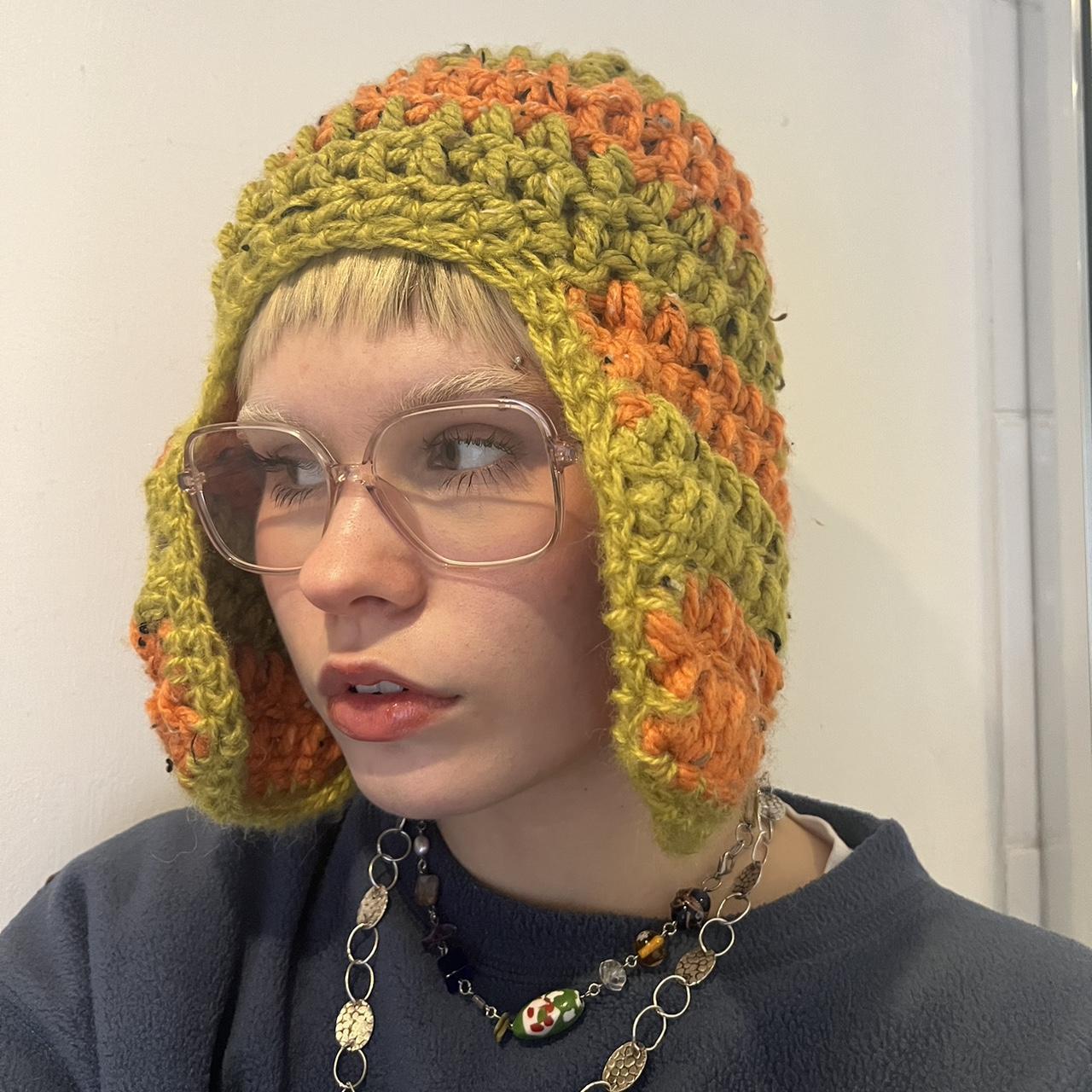 green and orange polo hat