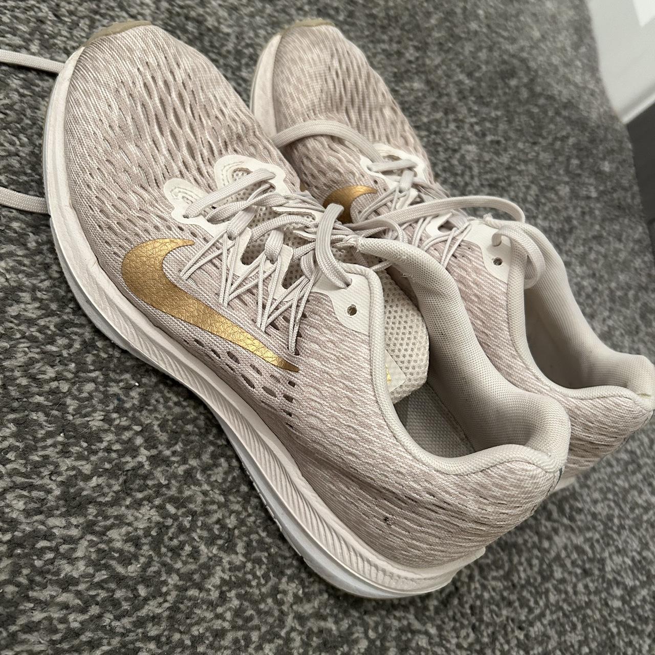 cream and black nike