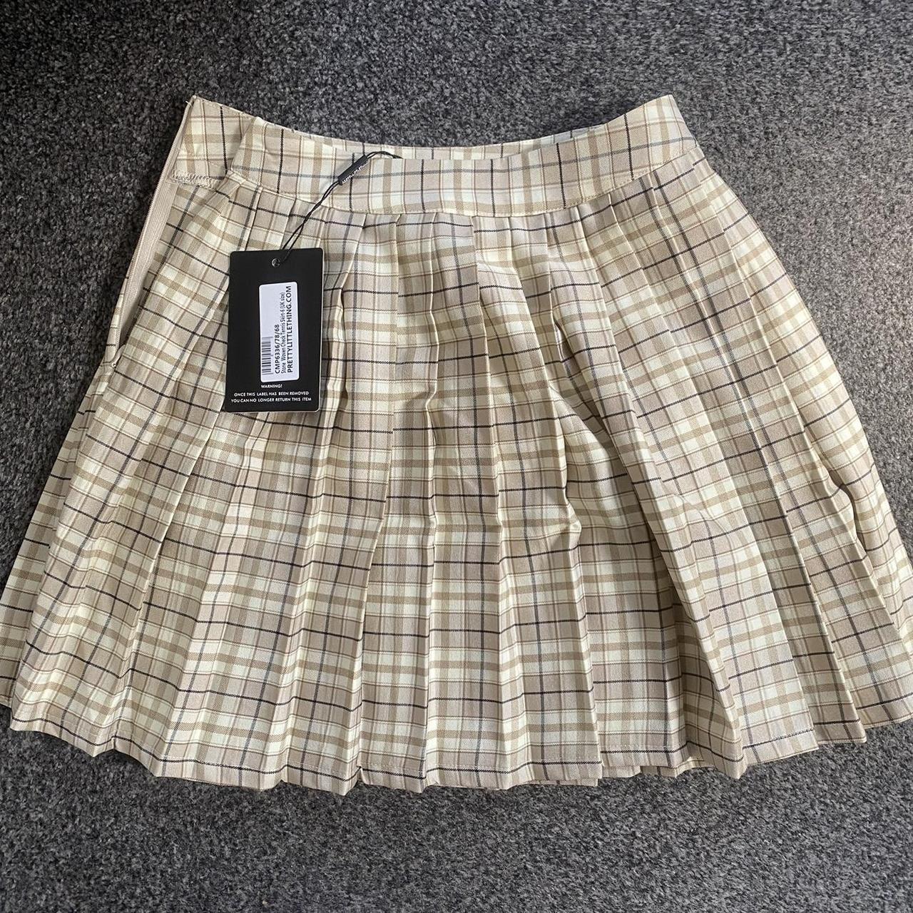Stone woven checkered pleated mini skirt from pretty... - Depop