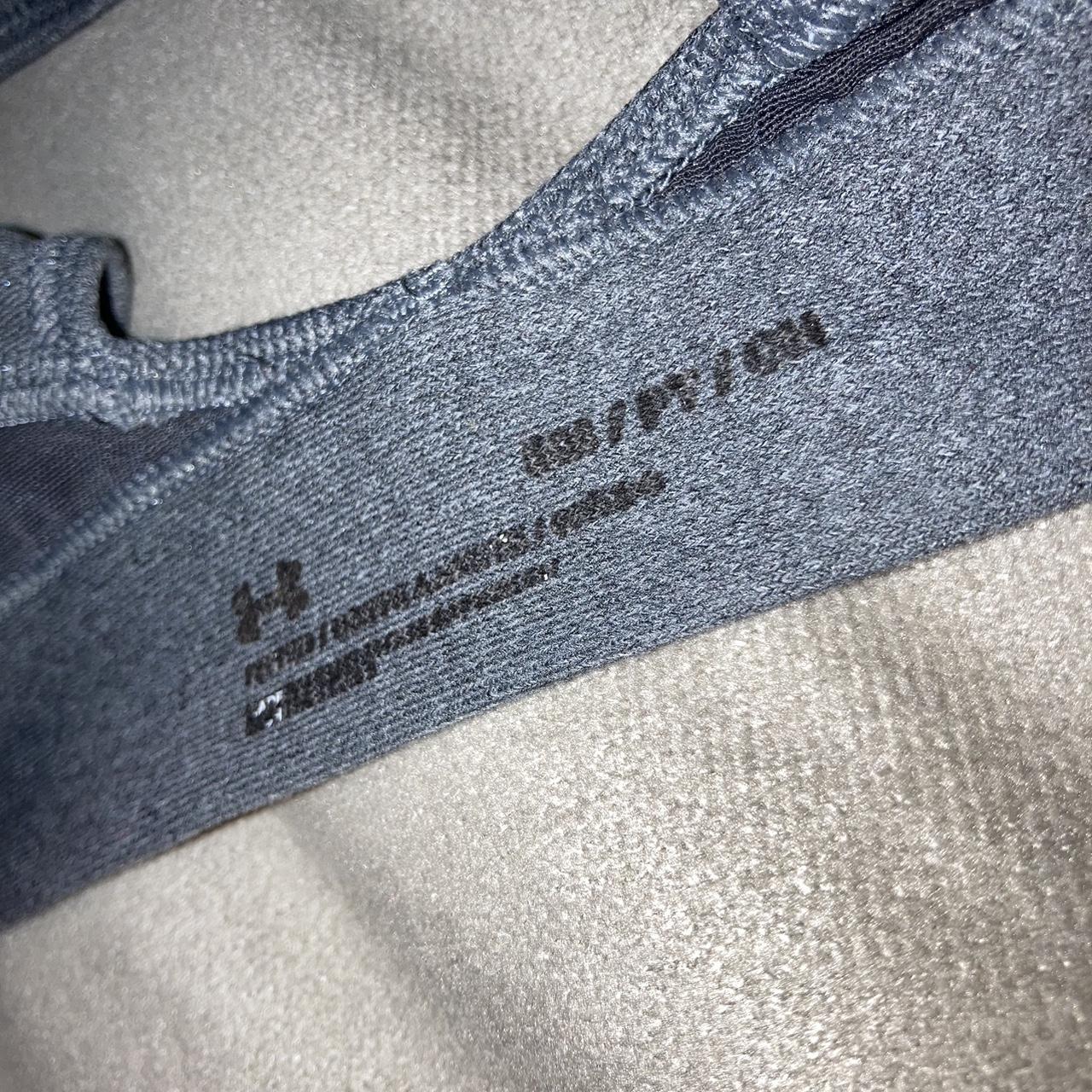 Grey padded Under Armor sports bra. a little worn,... Depop