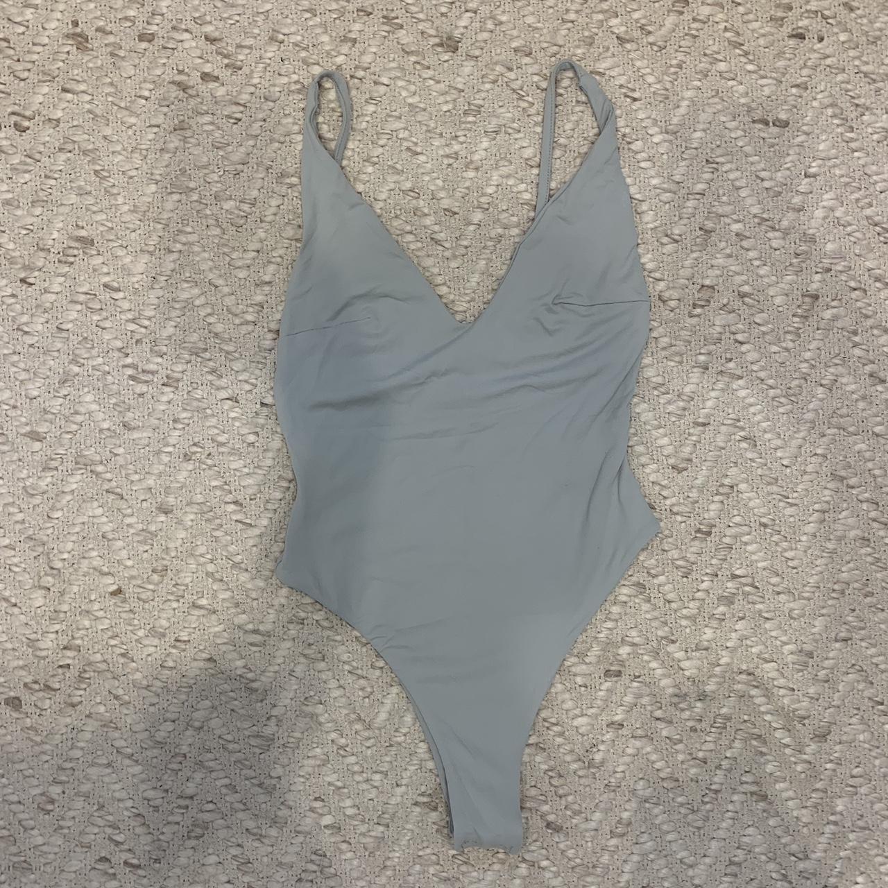 Kookai v neck bodysuit, light blue/grey Size 1... - Depop