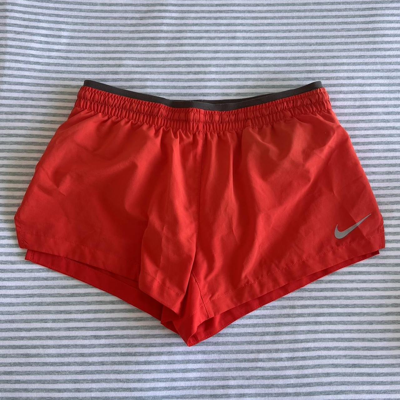Nike dri-fit bright orange shorts, with pockets and... - Depop