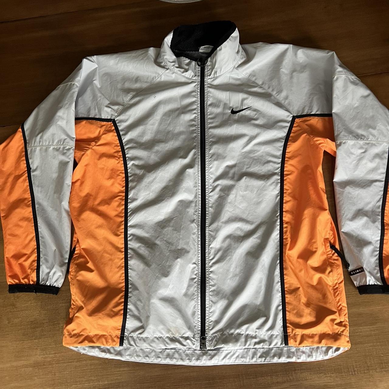 White and 2024 orange nike windbreaker