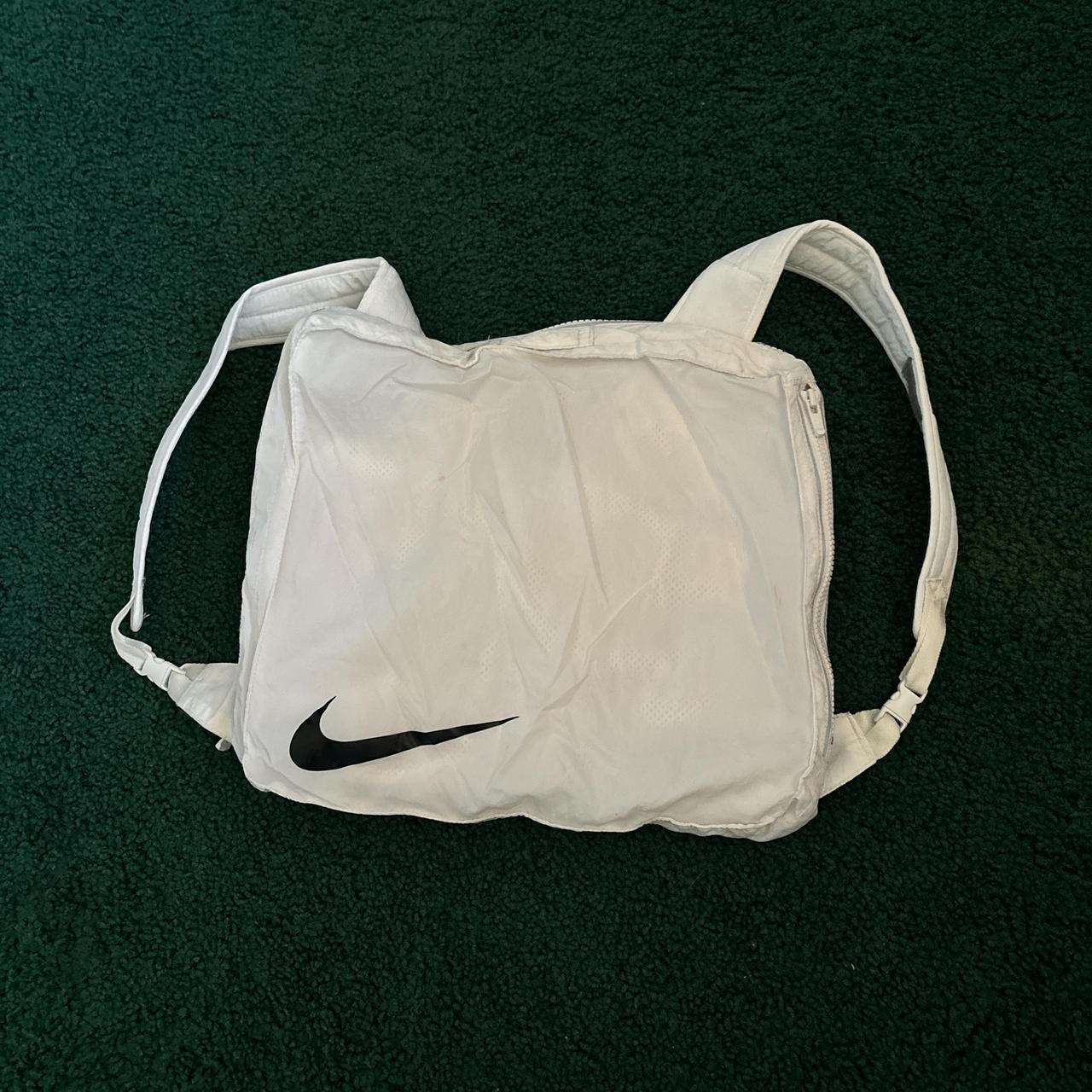 All white Nike tech pack rain poncho Turns into bag