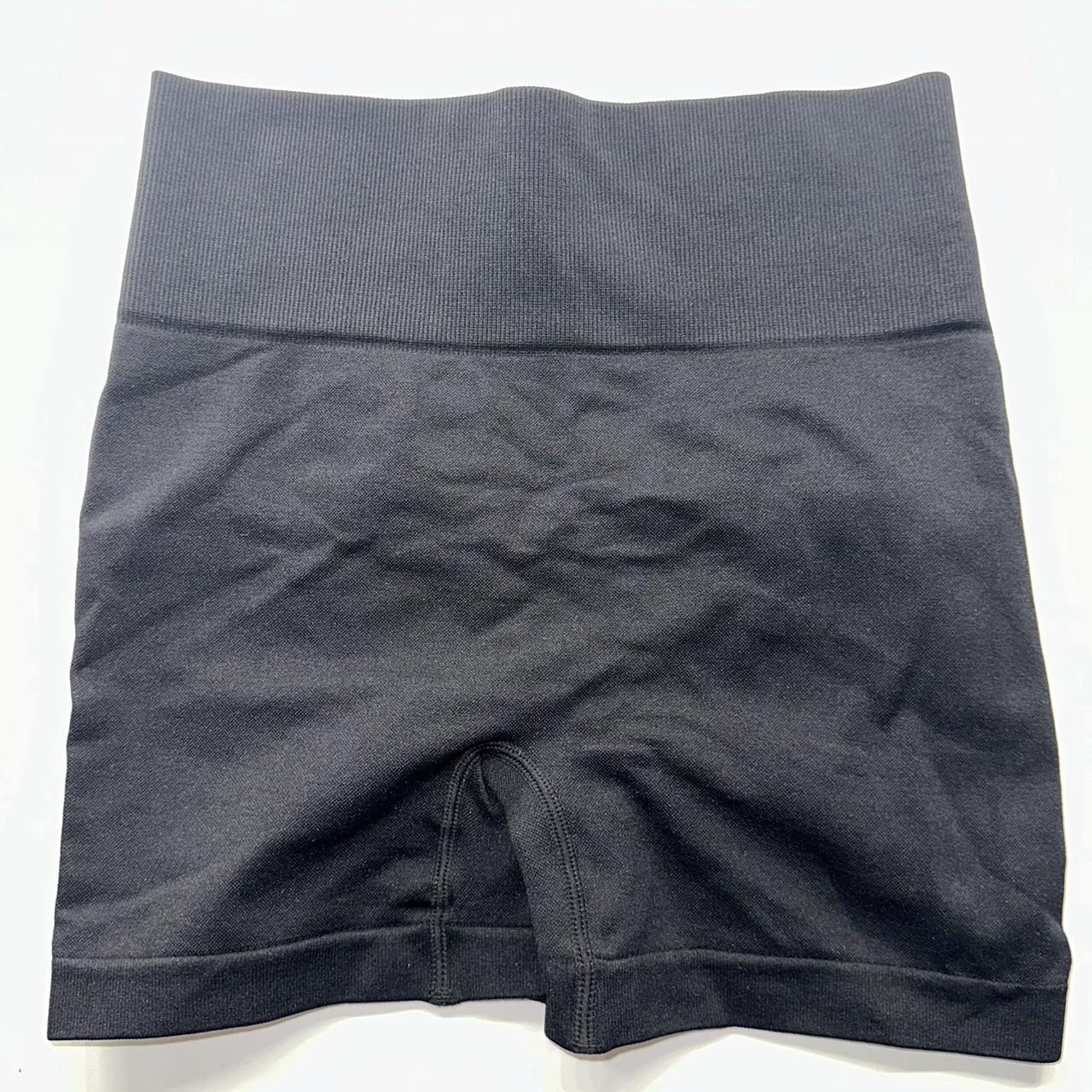 black gym shorts. no seam on the front, has a... - Depop