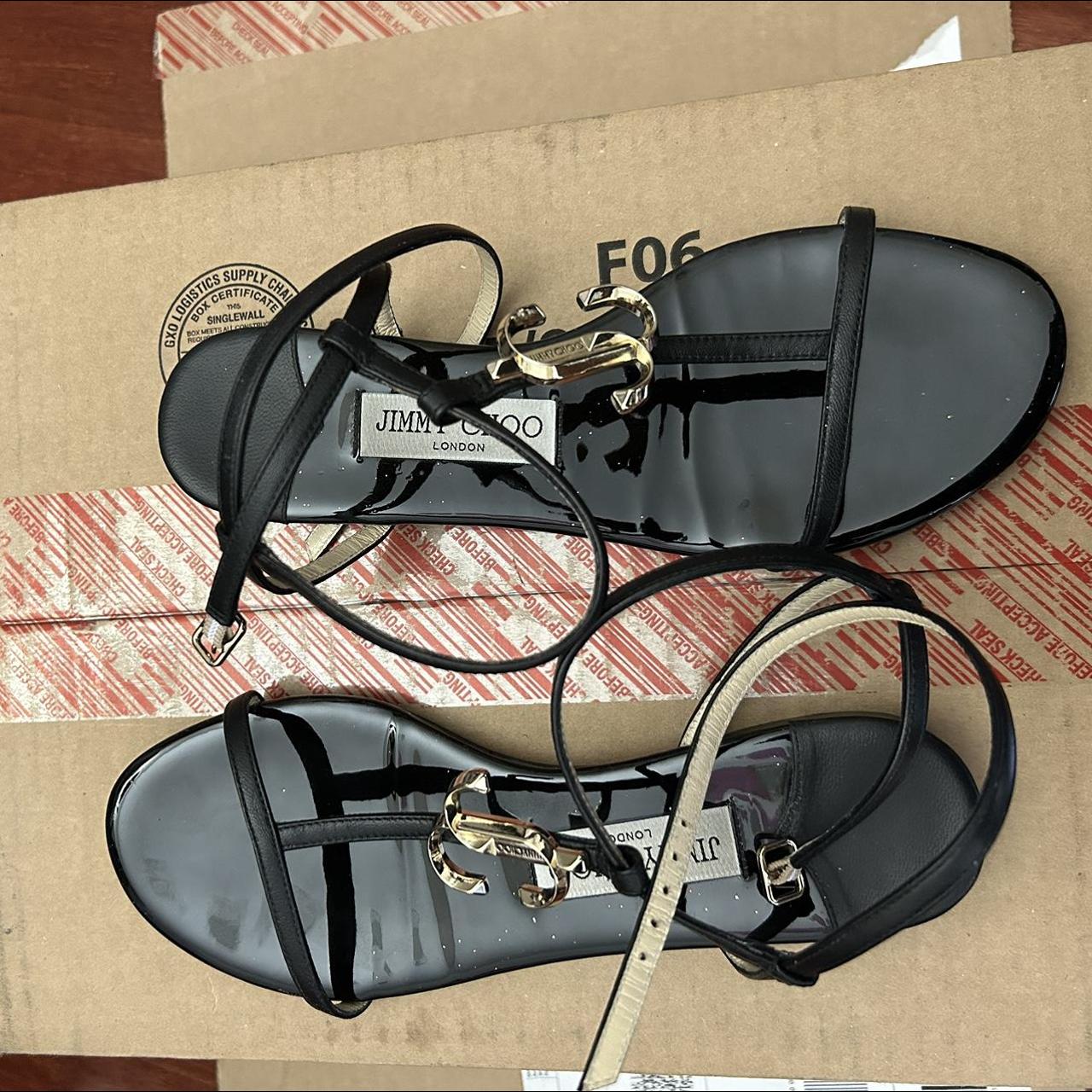 Jimmy Choo Women's Black and Gold Sandals | Depop